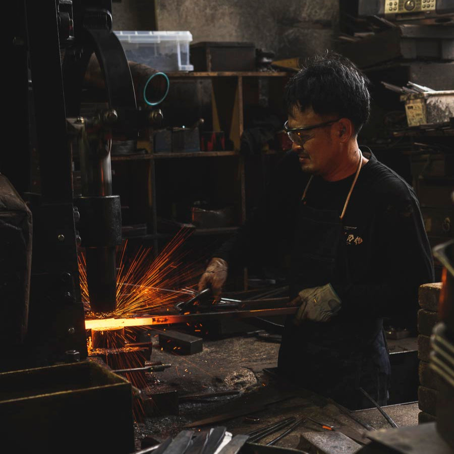 Blacksmith Forging a Deba